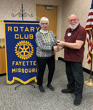 Ludtke receives pin from Lembke